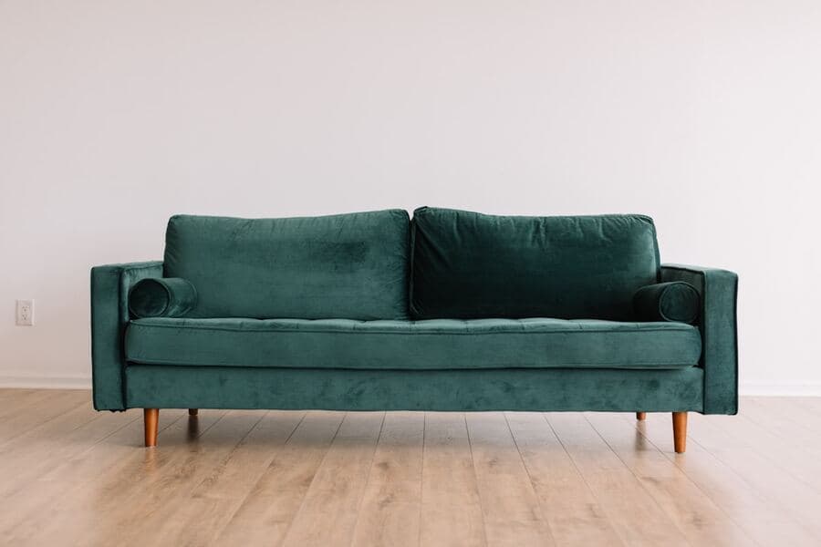 Emerald green velvet sofa