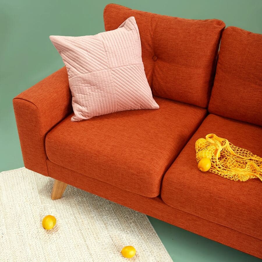 Rust orange fabric sofa